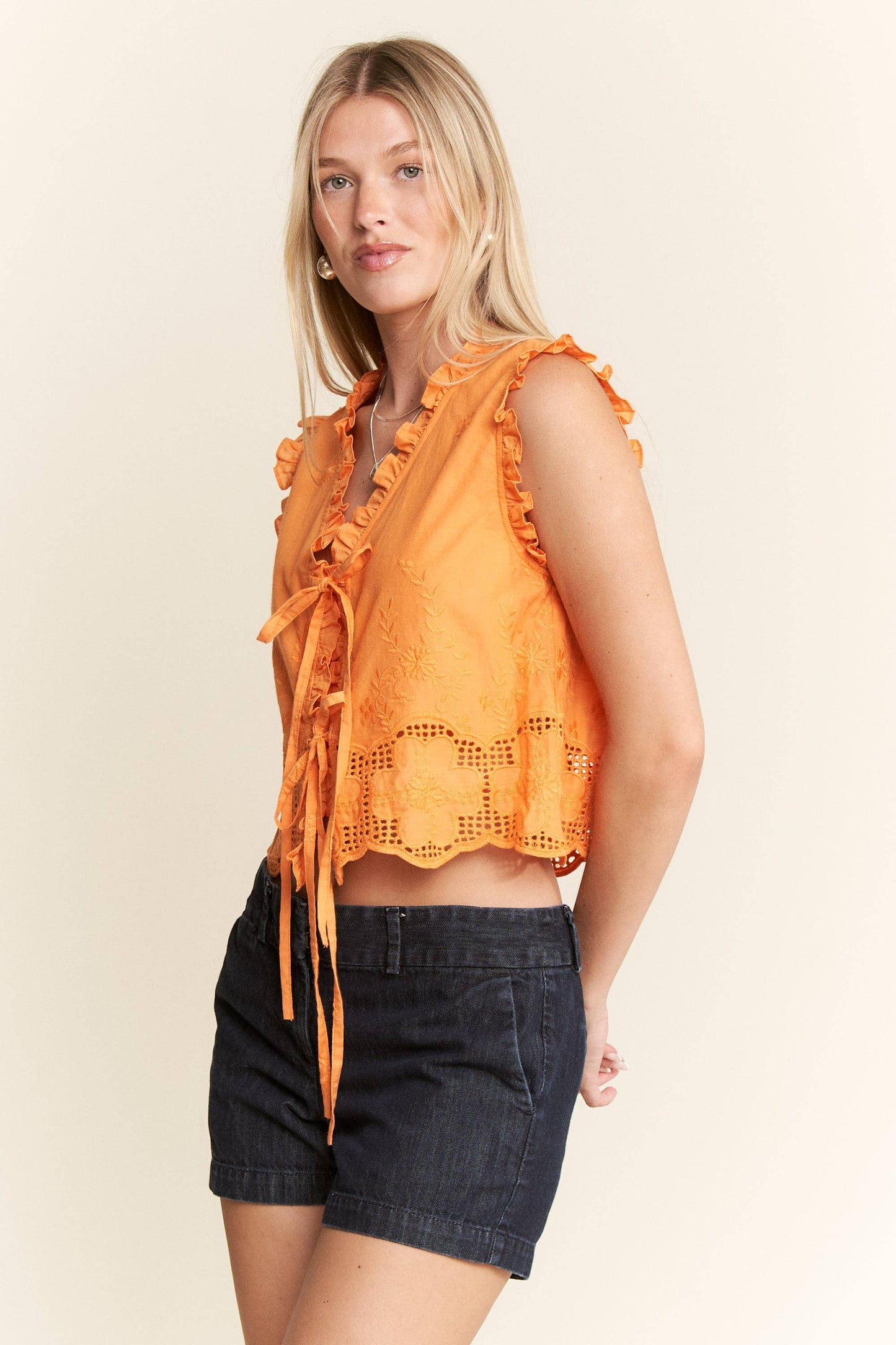 SLEEVELESS RUFFLE FRONT TIE TOP