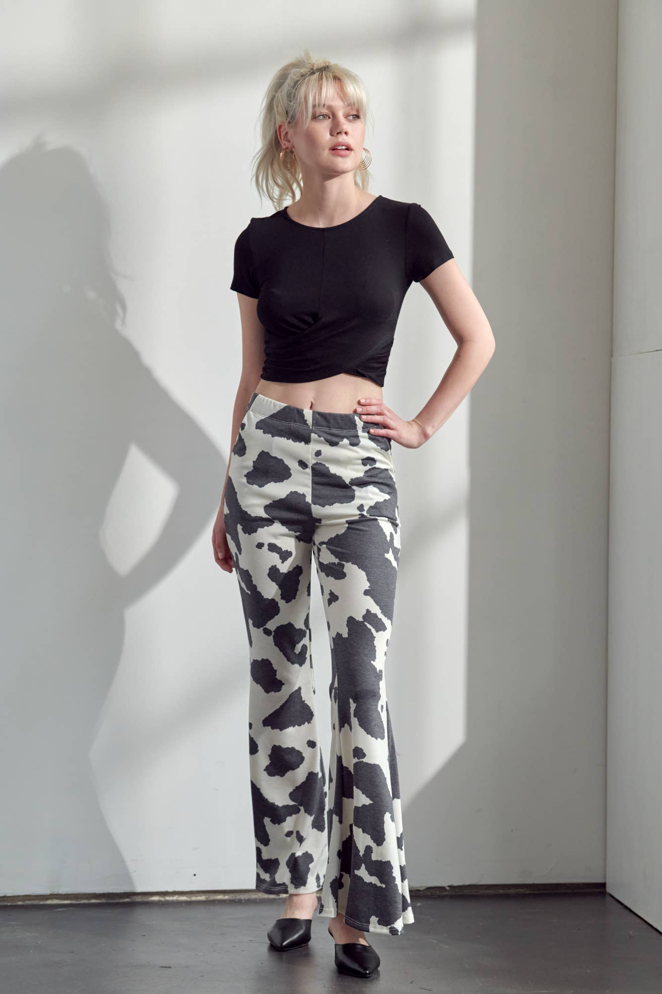 COW PRINT FLARED PANTS