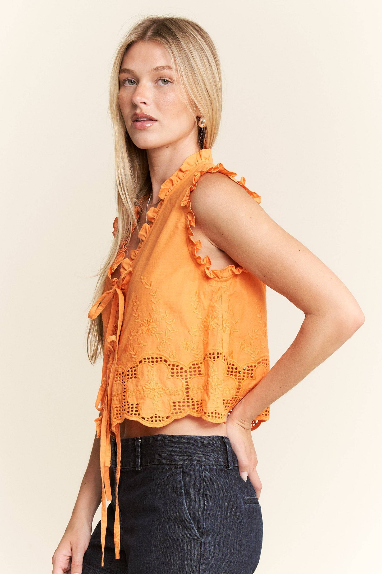 SLEEVELESS RUFFLE FRONT TIE TOP