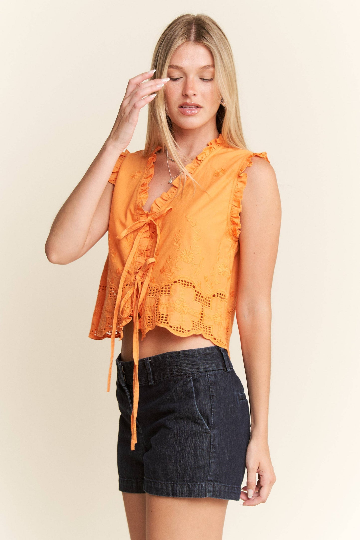 SLEEVELESS RUFFLE FRONT TIE TOP