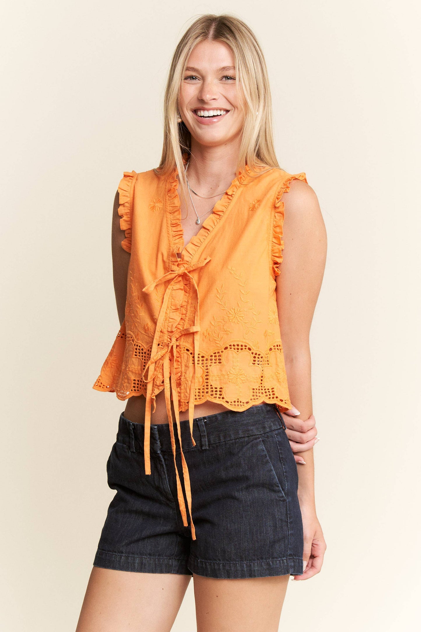 SLEEVELESS RUFFLE FRONT TIE TOP