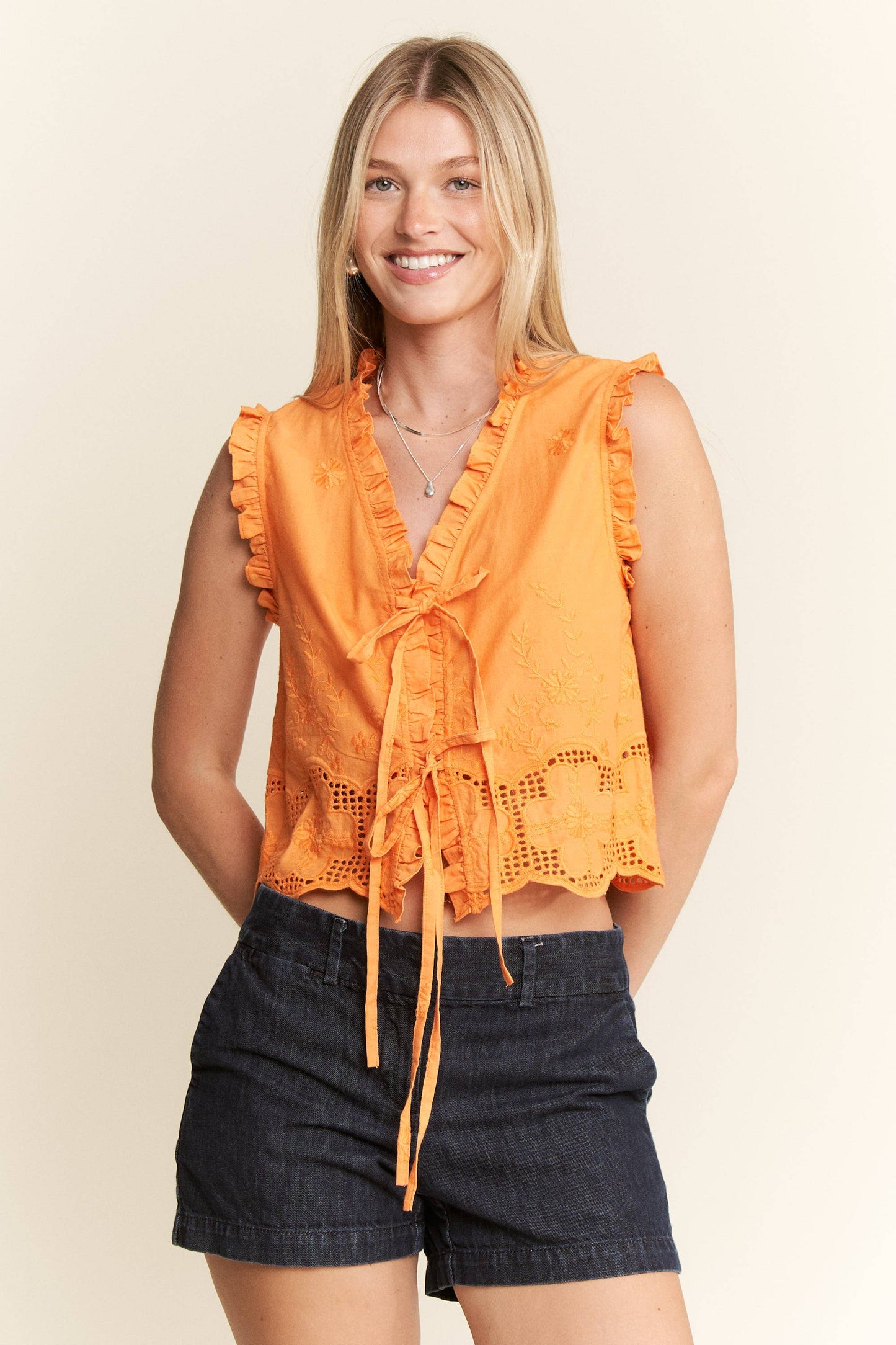 SLEEVELESS RUFFLE FRONT TIE TOP